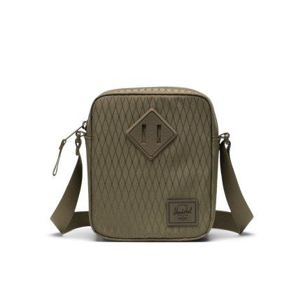 Detail crossbody tašky Herschel Heritage s diamantovým prvkem